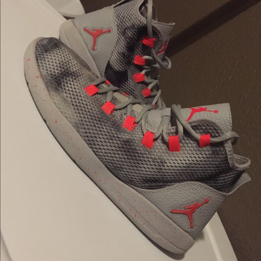 Gray and orange/red Jordan shoes